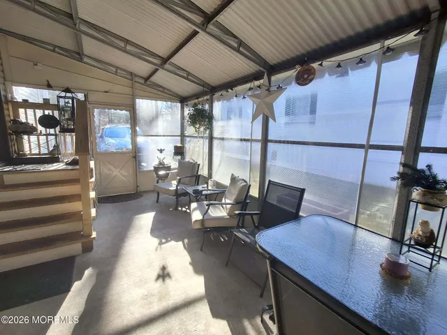 a living room with patio furniture