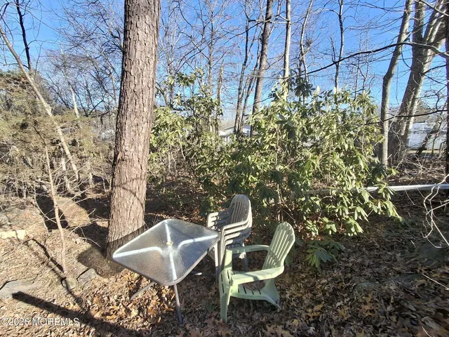 a view of a chairs and table in the patio