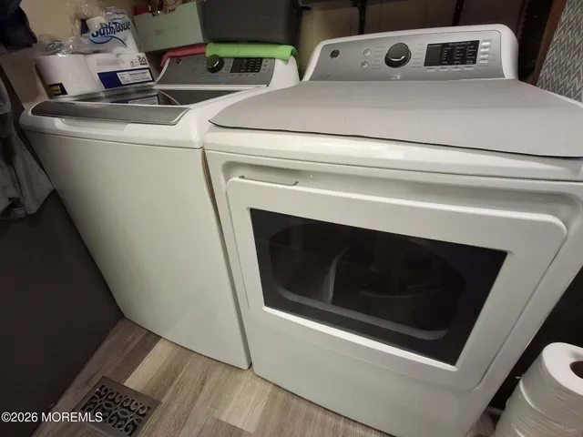 a utility room with washer and dryer