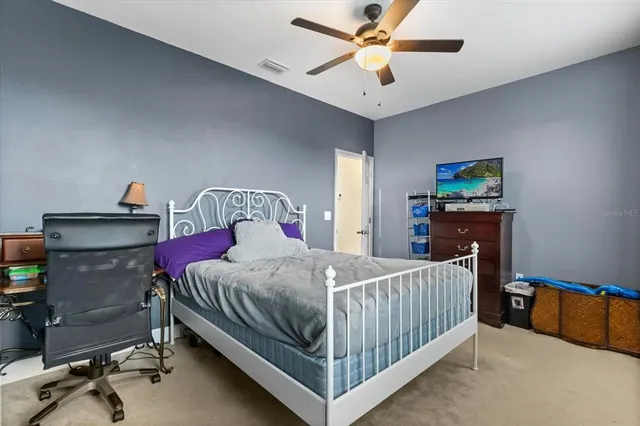 a bathroom with a double vanity sink toilet mirror and bathtub