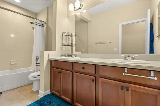 a view of a bedroom with furniture and windows
