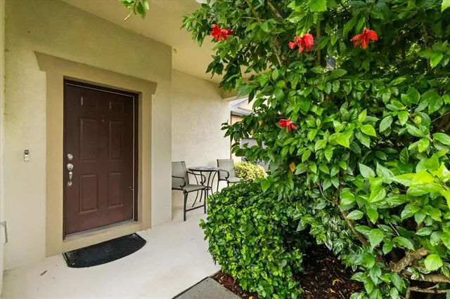 a view of an chairs and table in the balcony