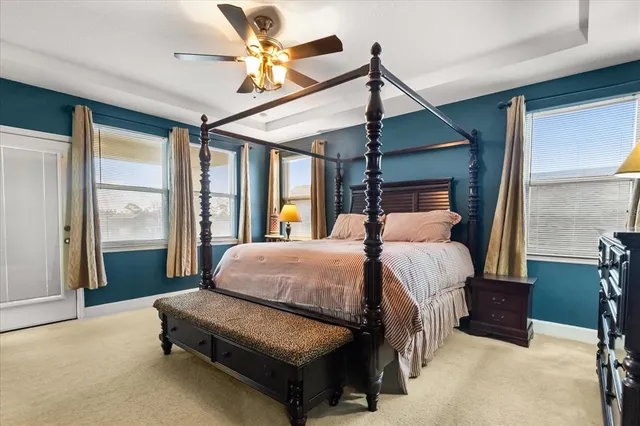 a large bathroom with a glass door shower and sink