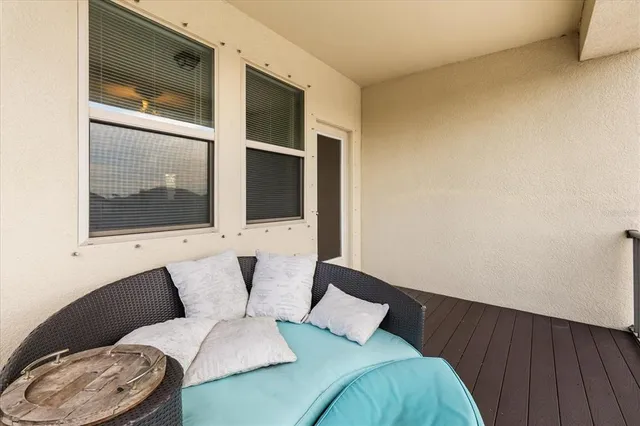 a view of a swimming pool with a table and chairs