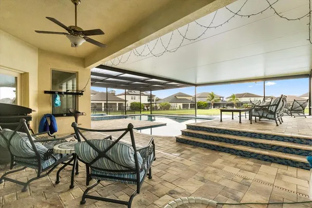 a view of a swimming pool with a patio