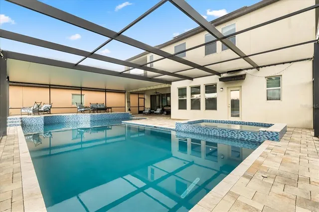 a view of a lake with houses in the background