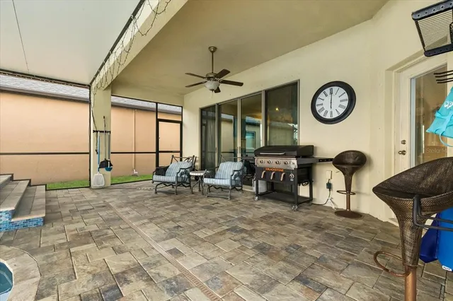 a view of a livingroom with workspace and a window