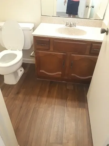 a bathroom with a toilet and a sink