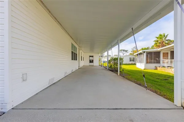 a view of a house with a yard from a balcony