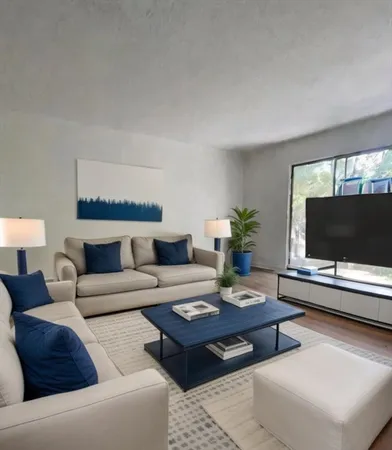 a living room with furniture and a flat screen tv