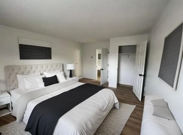 a bedroom with double bed and a flat screen tv