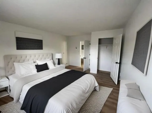 a bedroom with double bed and a flat screen tv