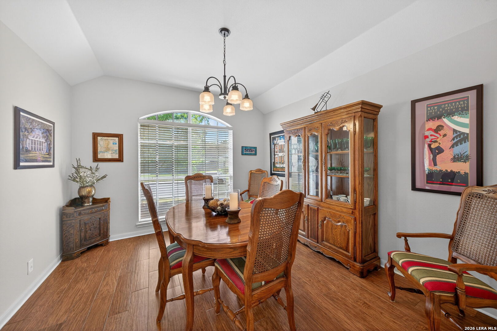 9331 Tyler Oaks Helotes, TX 78023 - Photo 19 of 47 a dining room with furniture a chandelier and wooden floor