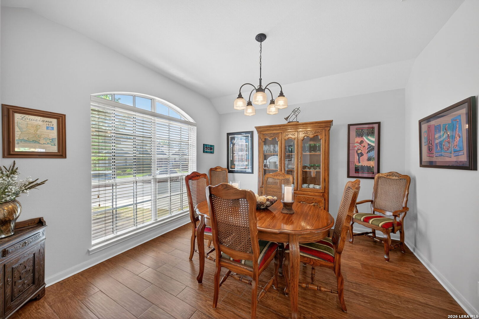 9331 Tyler Oaks Helotes, TX 78023 - Photo 20 of 47 a view of a dining room with furniture wooden floor and chandelier
