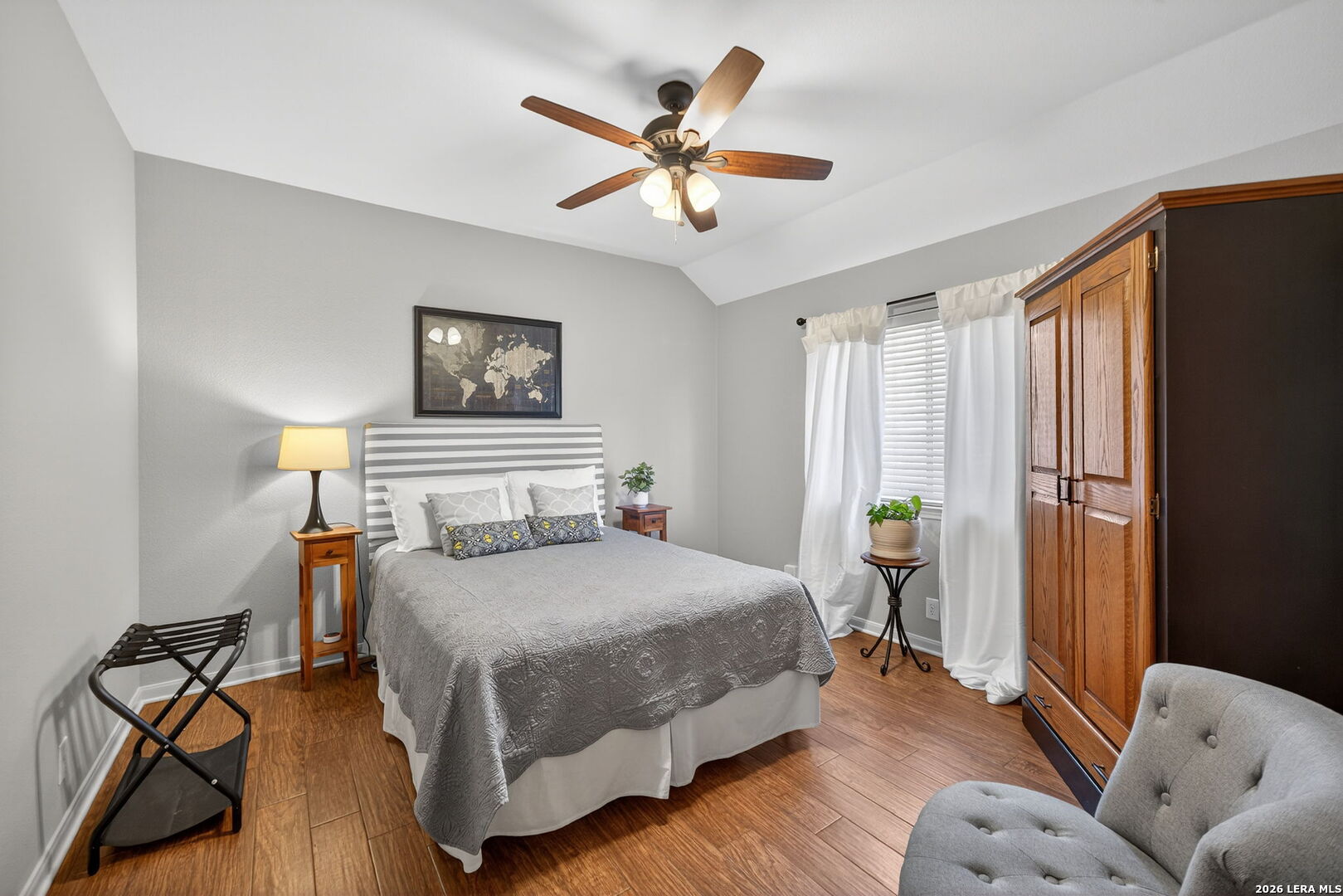 9331 Tyler Oaks Helotes, TX 78023 - Photo 30 of 47 a bedroom with a bed and wooden floor