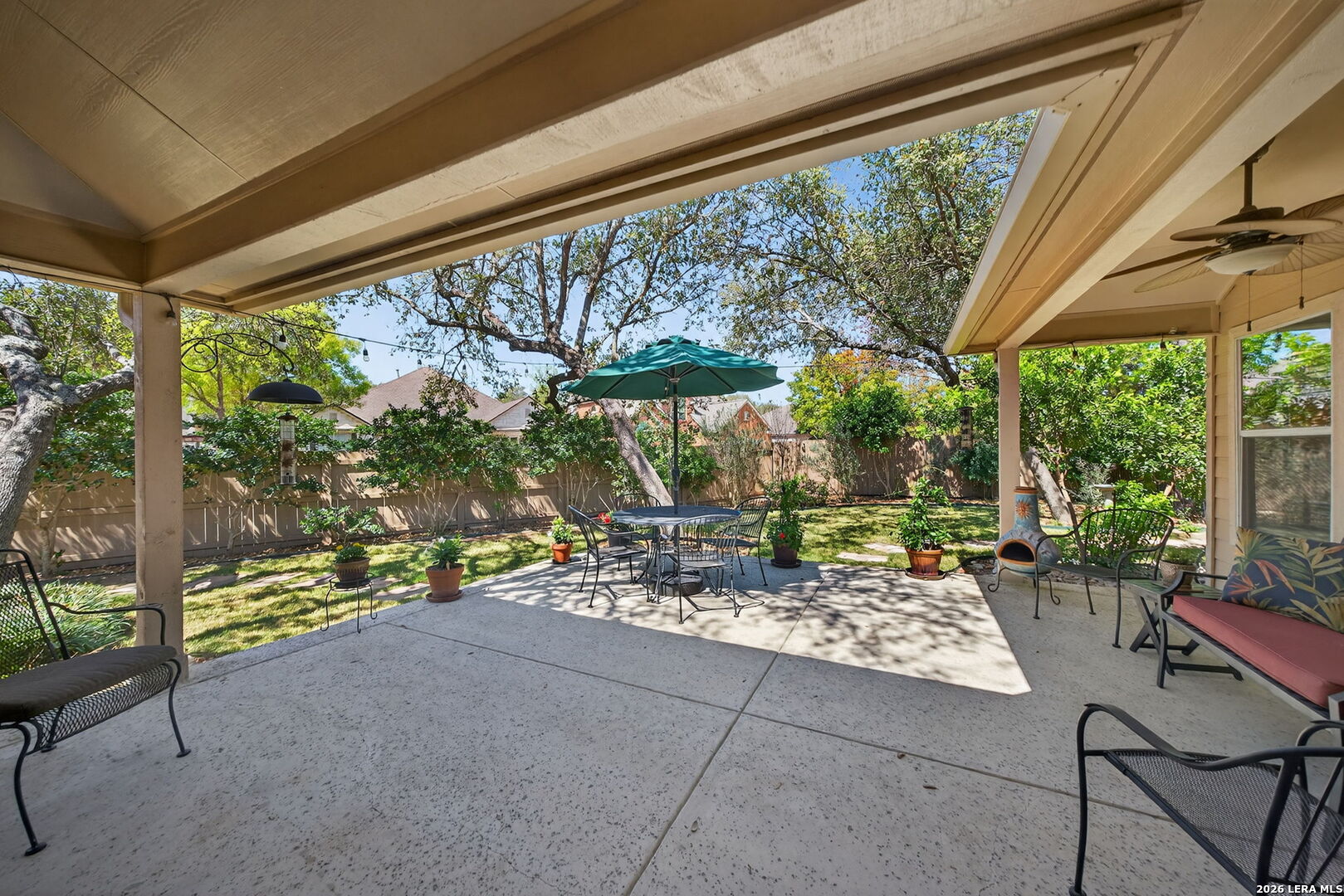 9331 Tyler Oaks Helotes, TX 78023 - Photo 33 of 47 a living room with patio furniture and a floor to ceiling window