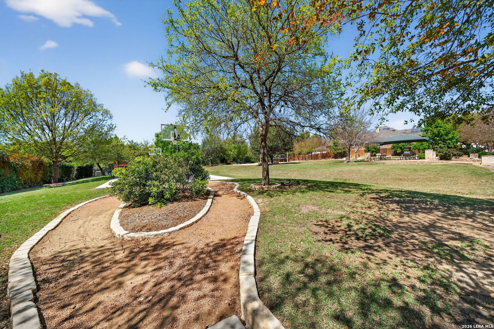9331 Tyler Oaks Helotes, TX 78023 - Photo 46 of 47 a backyard of water with a fountain and barbeque oven