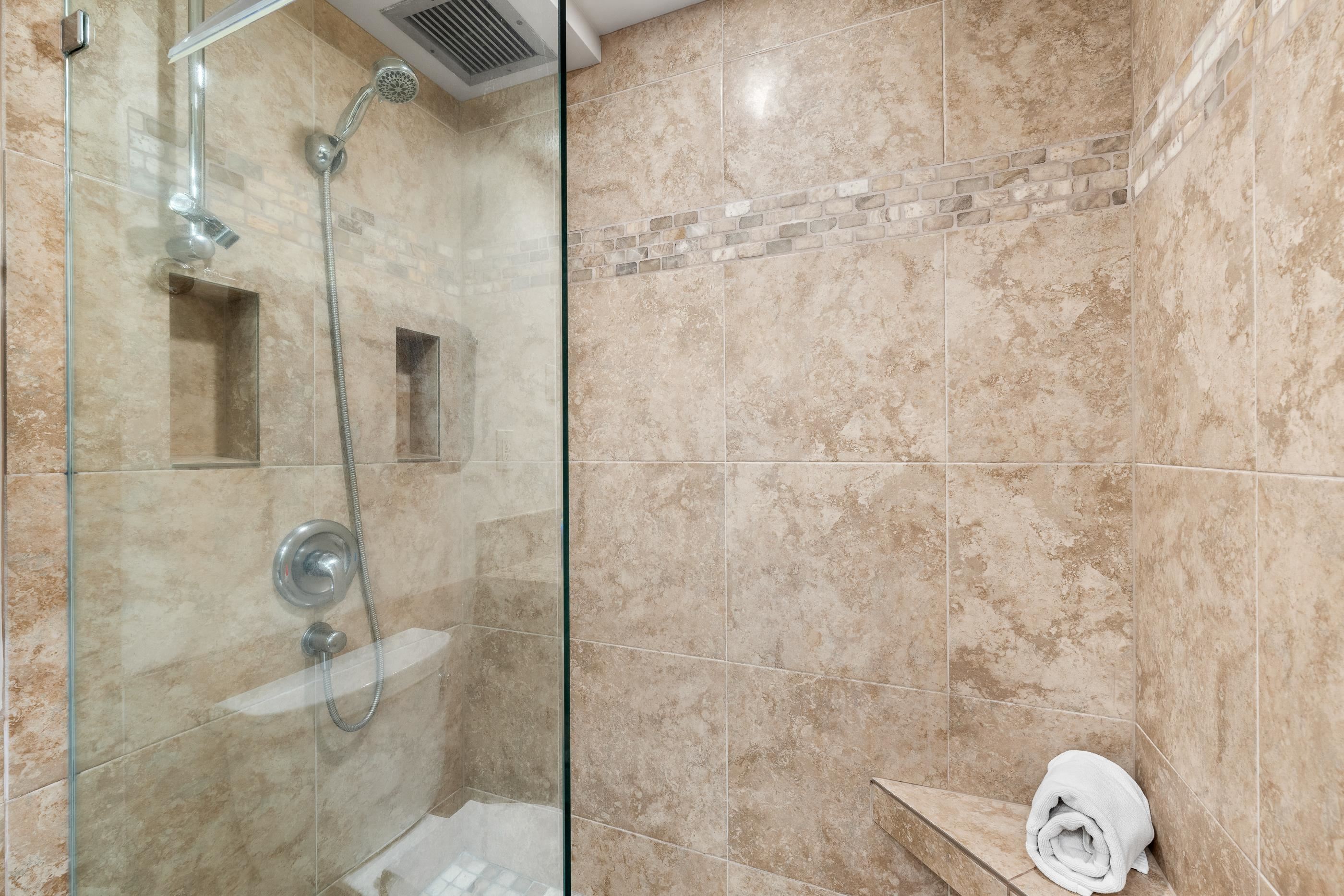 2960 South Kihei Road, Unit 310 Kihei, HI 96753 - Photo 11 of 35 a bathroom with a wooden floor and a shower