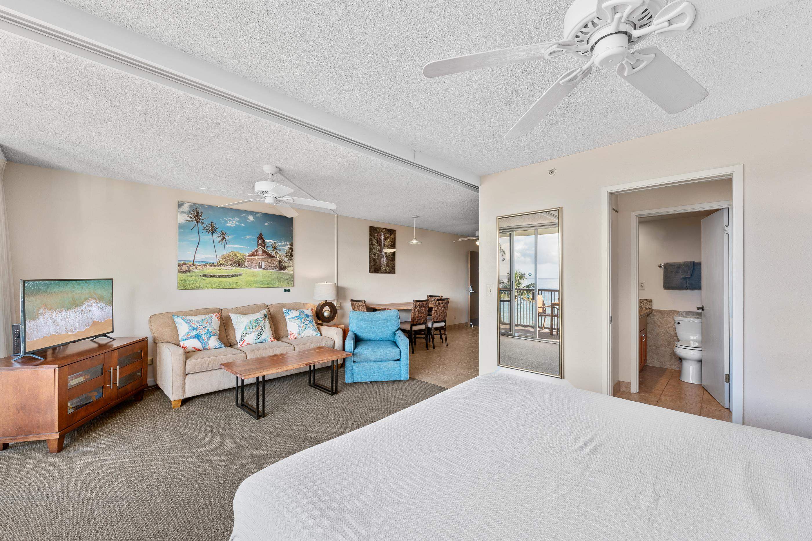 2960 South Kihei Road, Unit 310 Kihei, HI 96753 - Photo 17 of 35 a bedroom with a bed couch and view of living room