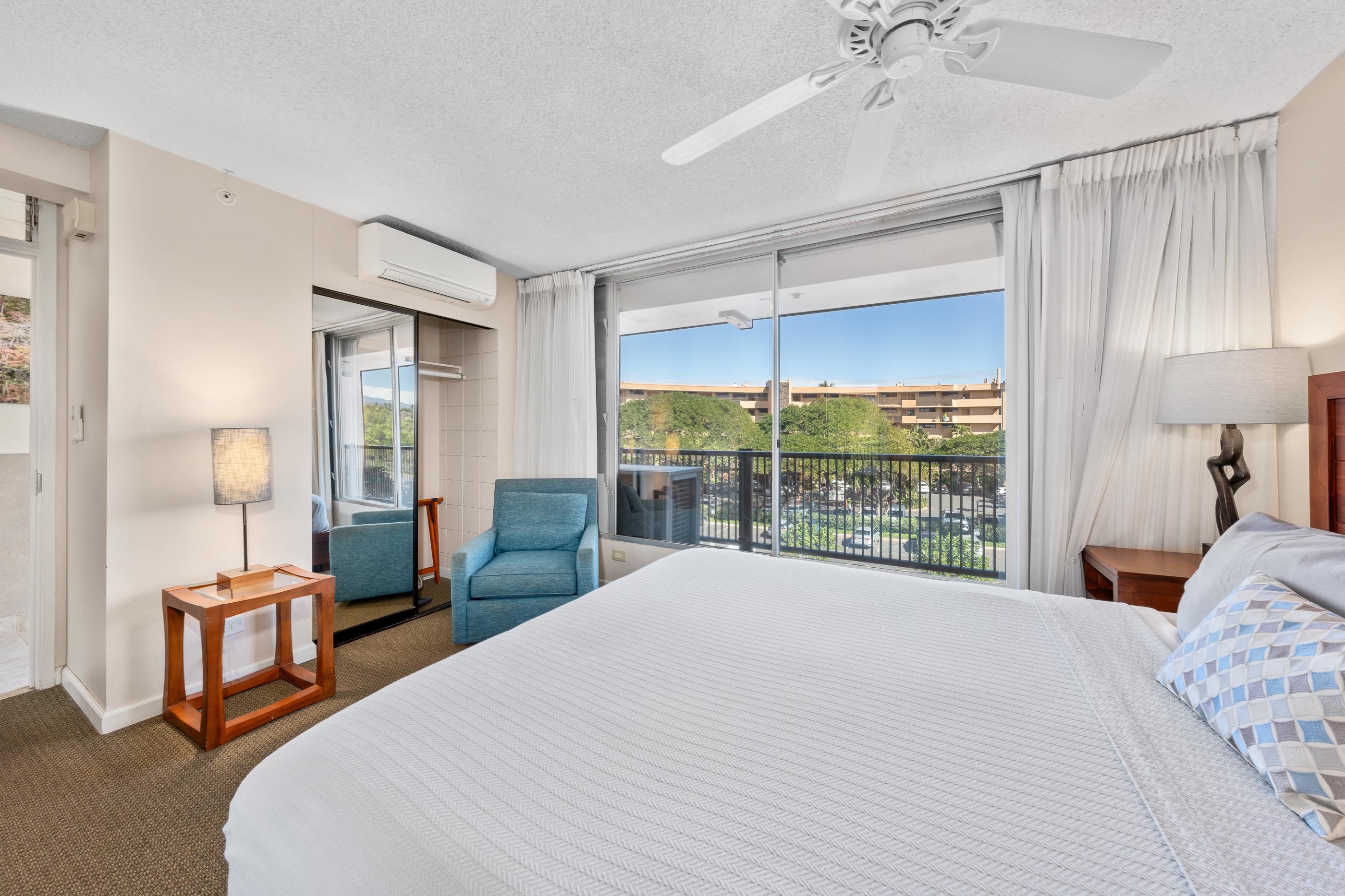2960 South Kihei Road, Unit 310 Kihei, HI 96753 - Photo 19 of 35 a large bedroom with a bed and large window