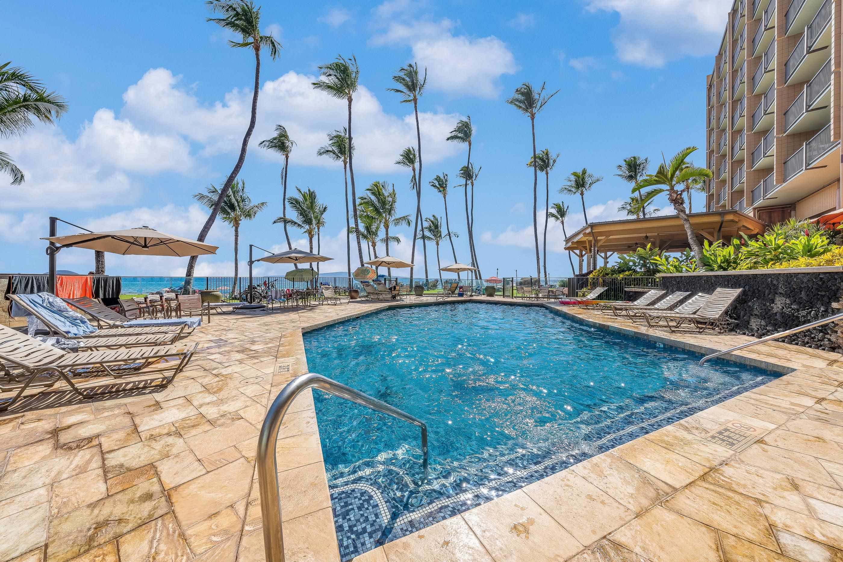 2960 South Kihei Road, Unit 310 Kihei, HI 96753 - Photo 25 of 35 a swimming pool with outdoor seating and yard