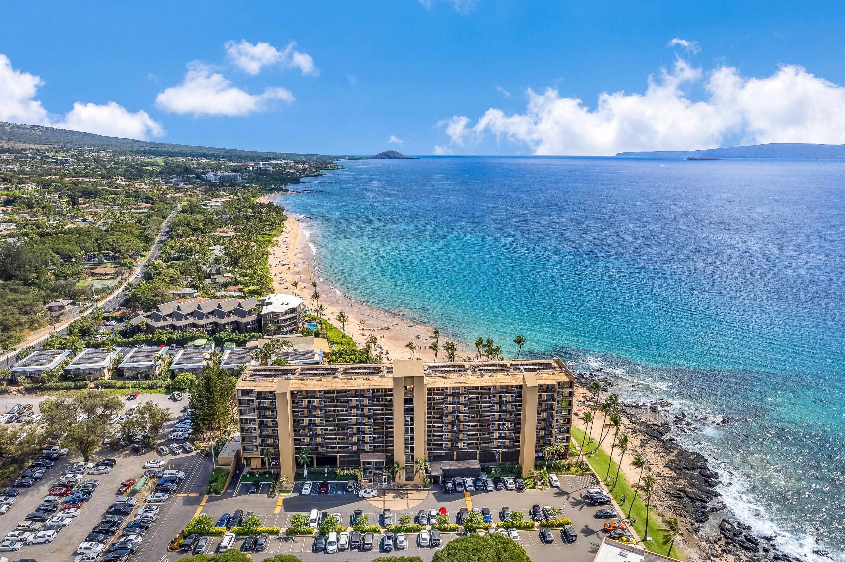2960 South Kihei Road, Unit 310 Kihei, HI 96753 - Photo 27 of 35 a view of building with an outdoor space and seating