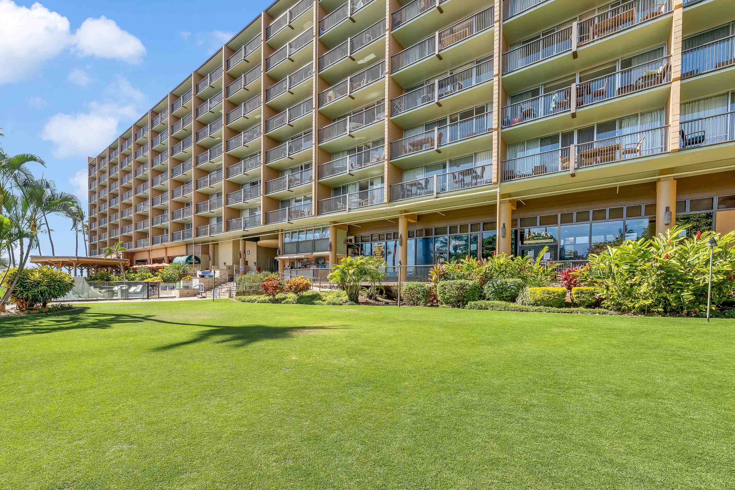 2960 South Kihei Road, Unit 310 Kihei, HI 96753 - Photo 31 of 35 a front view of a building with play ground and trees