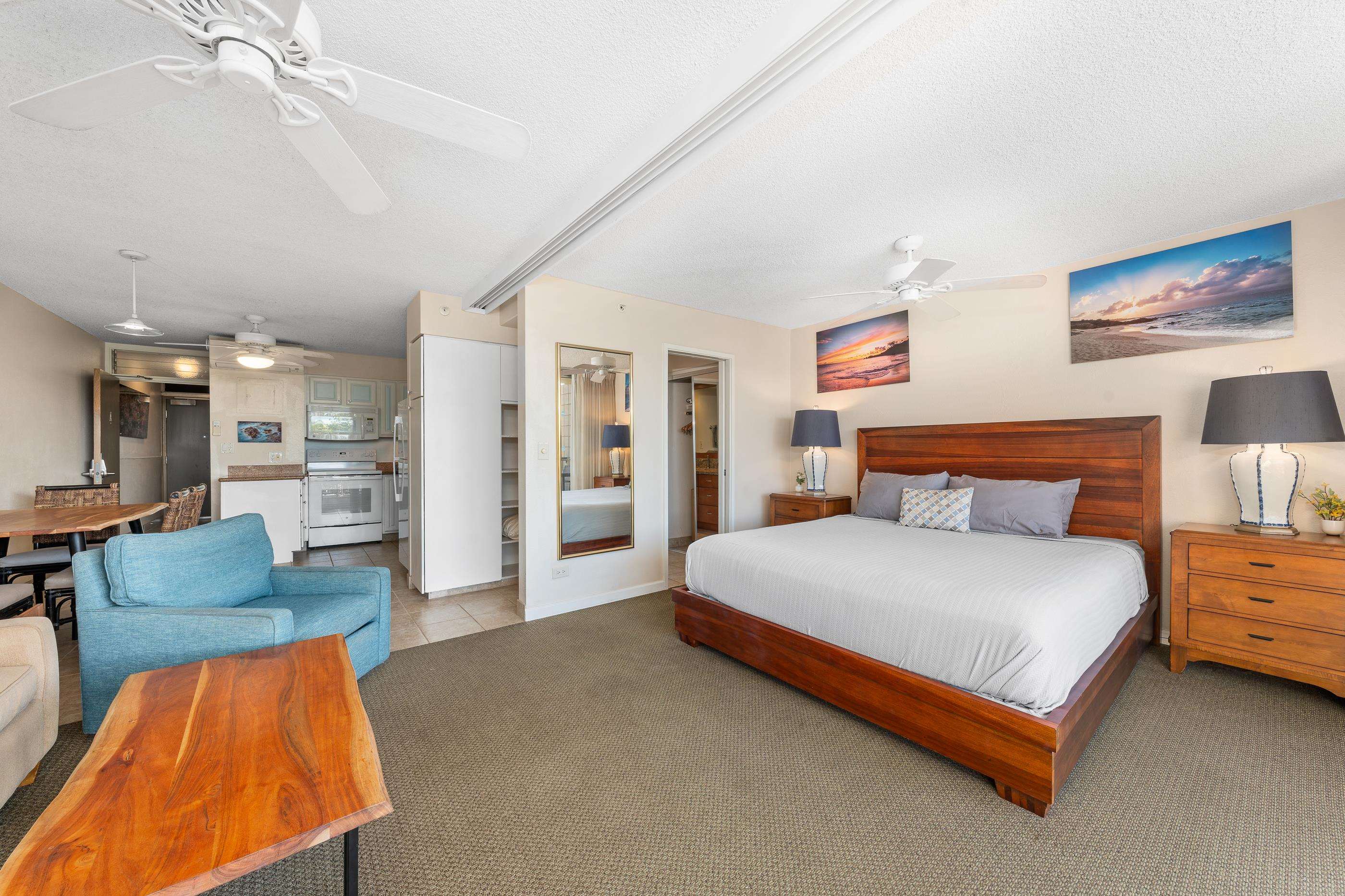 2960 South Kihei Road, Unit 310 Kihei, HI 96753 - Photo 6 of 35 a spacious bedroom with a bed and glass walk in closet