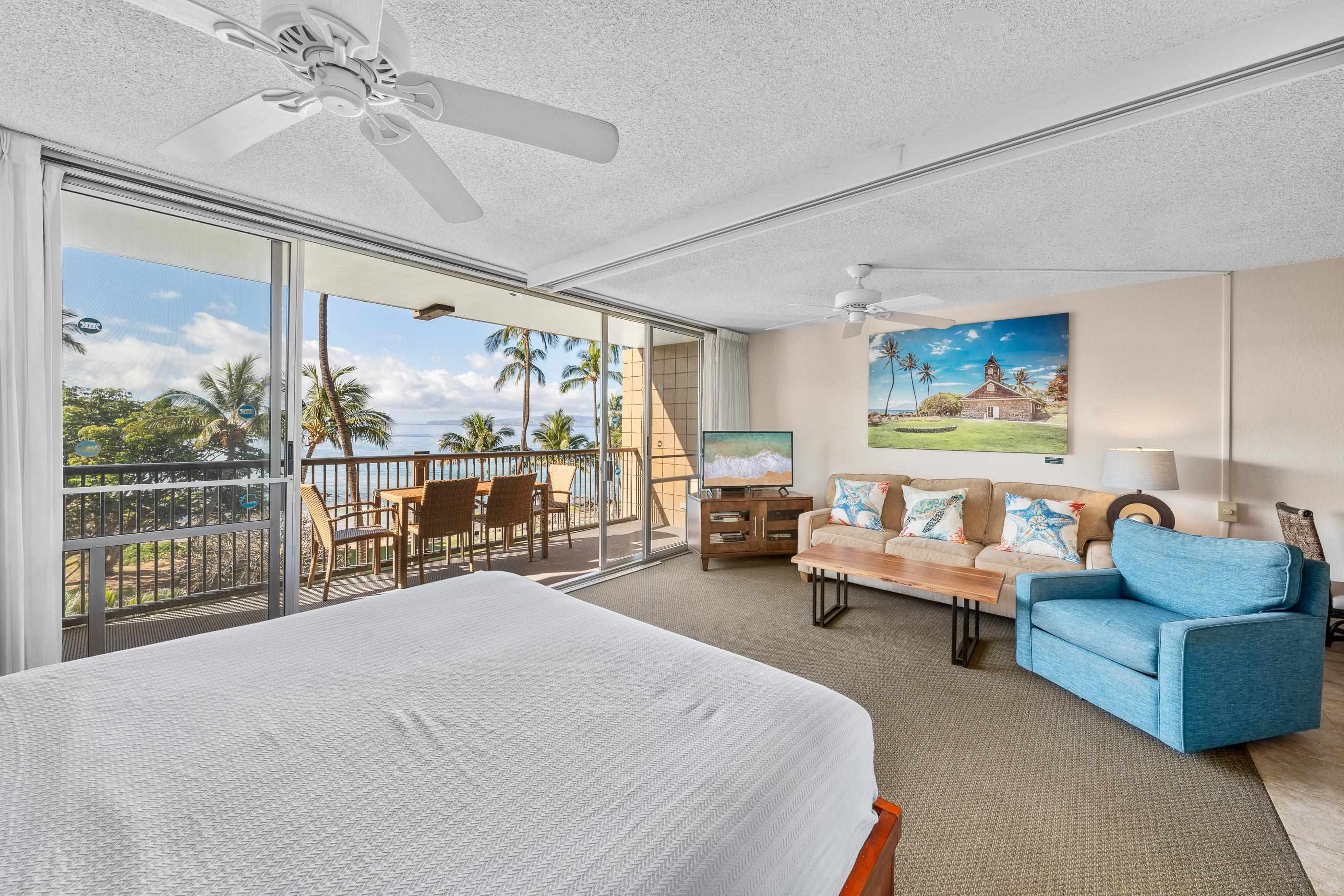 2960 South Kihei Road, Unit 310 Kihei, HI 96753 - Photo 7 of 35 a bed room with couch and a large window