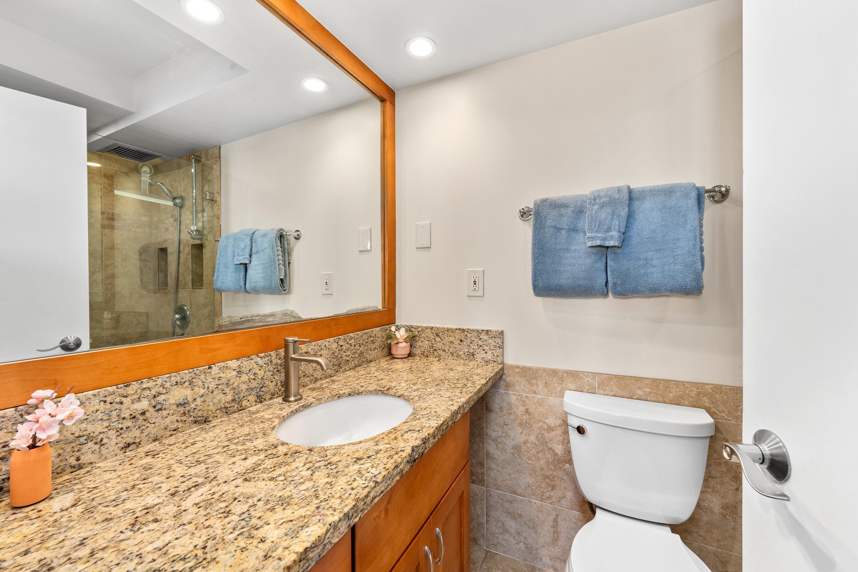 2960 South Kihei Road, Unit 310 Kihei, HI 96753 - Photo 10 of 35 a bathroom with a granite countertop sink and a mirror
