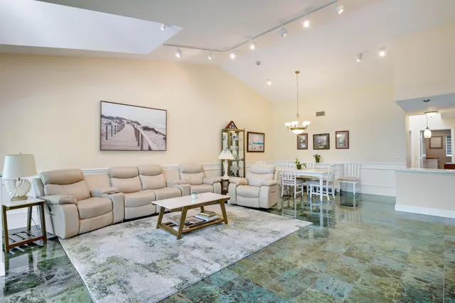 a living room with furniture and a table