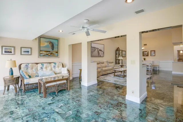 a view of a livingroom with furniture and a flat screen tv