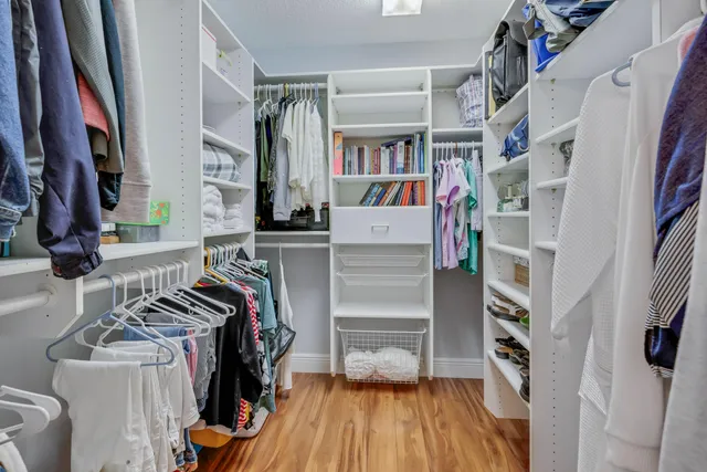 a bedroom with a bed and a table