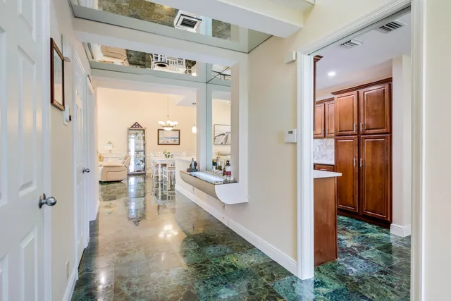 a view of living room with furniture and a floor to ceiling window