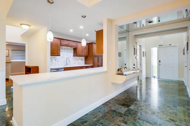a large bathroom with a sink and a mirror