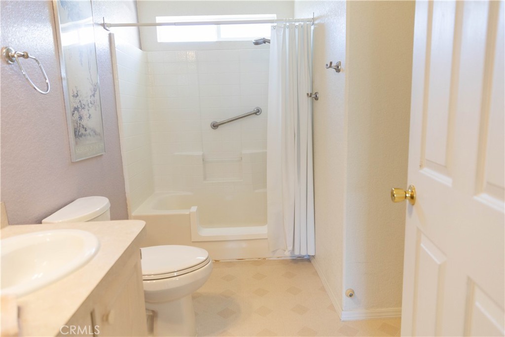 2140 Mentone, Unit 3 Mentone, CA 92359 - Photo 18 of 45 a bathroom with a toilet and a shower