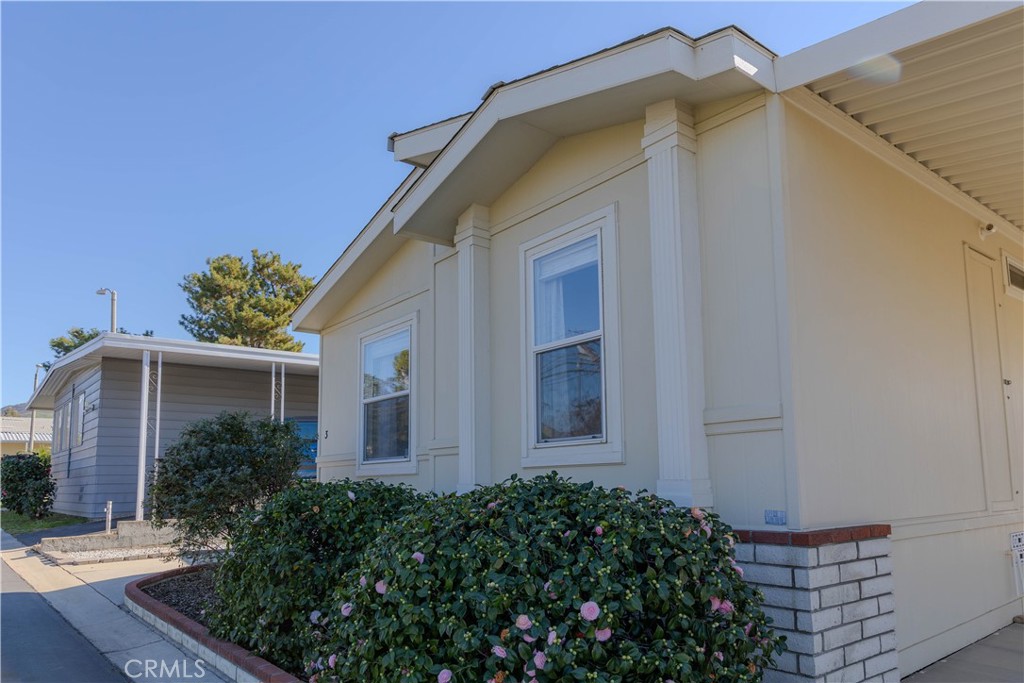 2140 Mentone, Unit 3 Mentone, CA 92359 - Photo 2 of 45 a view of a house with a small yard and plants