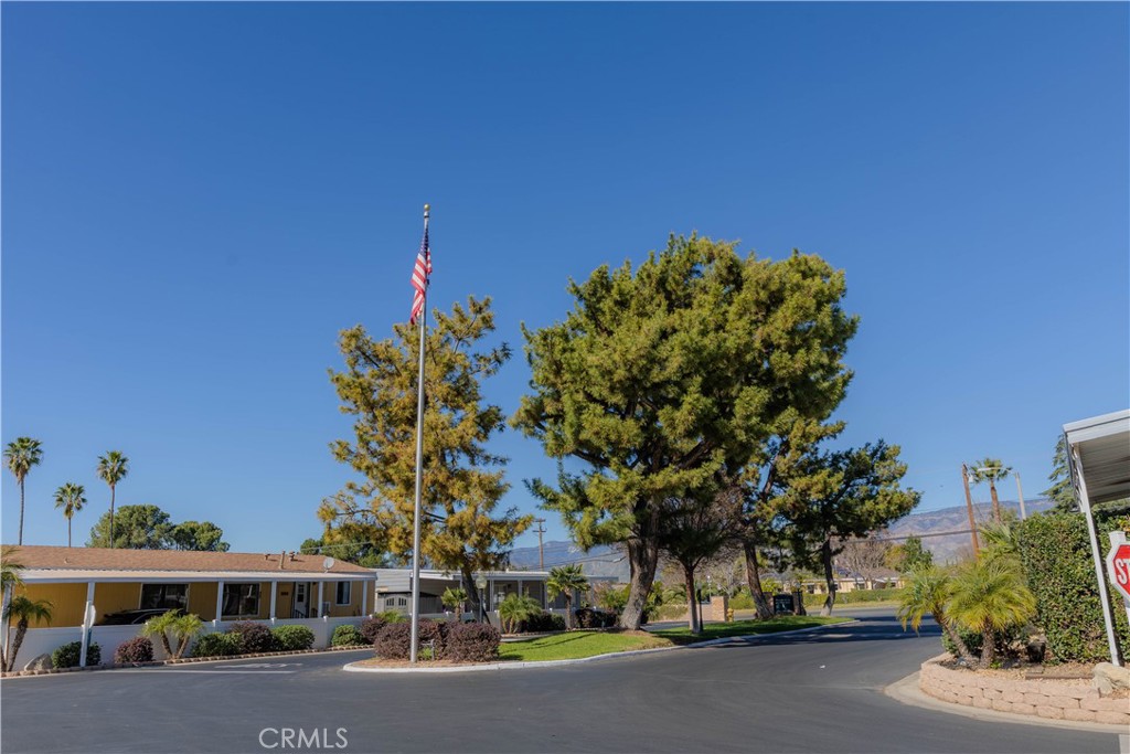 2140 Mentone, Unit 3 Mentone, CA 92359 - Photo 27 of 45 a front view of a house with a yard