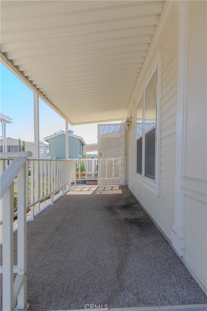 2140 Mentone, Unit 3 Mentone, CA 92359 - Photo 4 of 45 a view of an empty room with wooden floor and stairs
