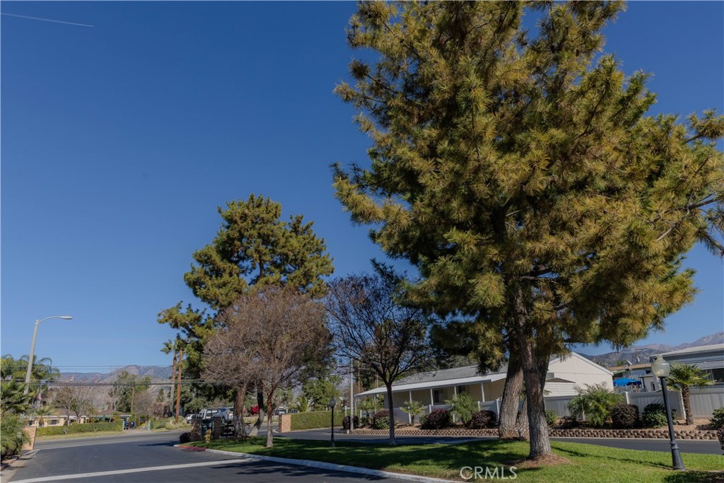 2140 Mentone, Unit 3 Mentone, CA 92359 - Photo 42 of 45 a front view of a building with trees