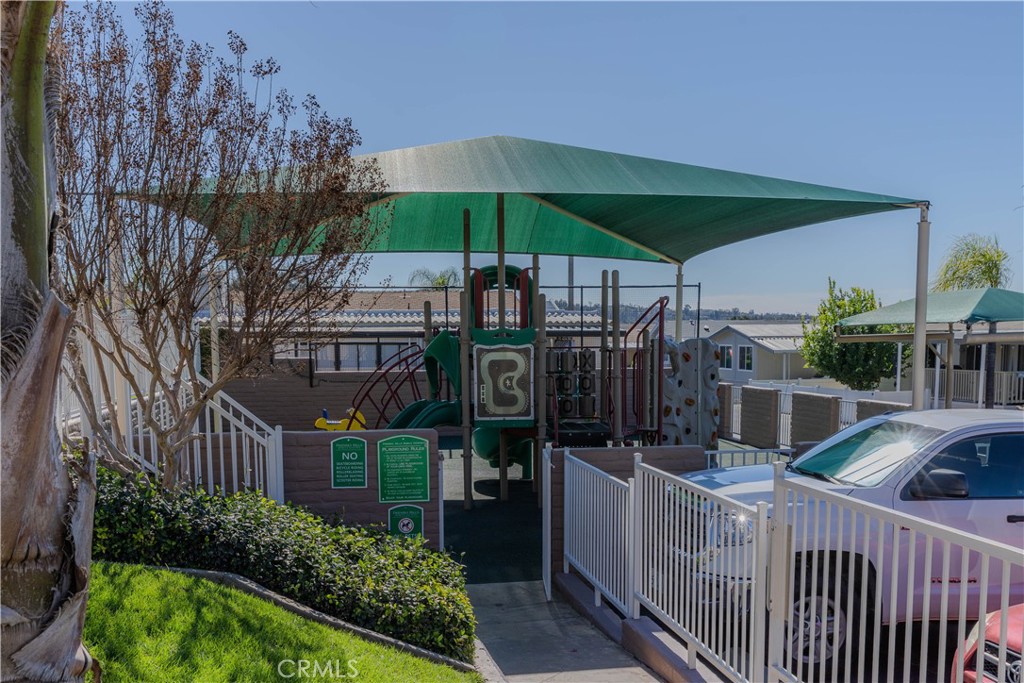 2140 Mentone, Unit 3 Mentone, CA 92359 - Photo 43 of 45 a view of a chairs and table in backyard