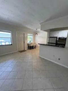a large kitchen with cabinets and a stove