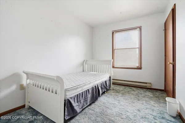 a view of a room with wooden walls