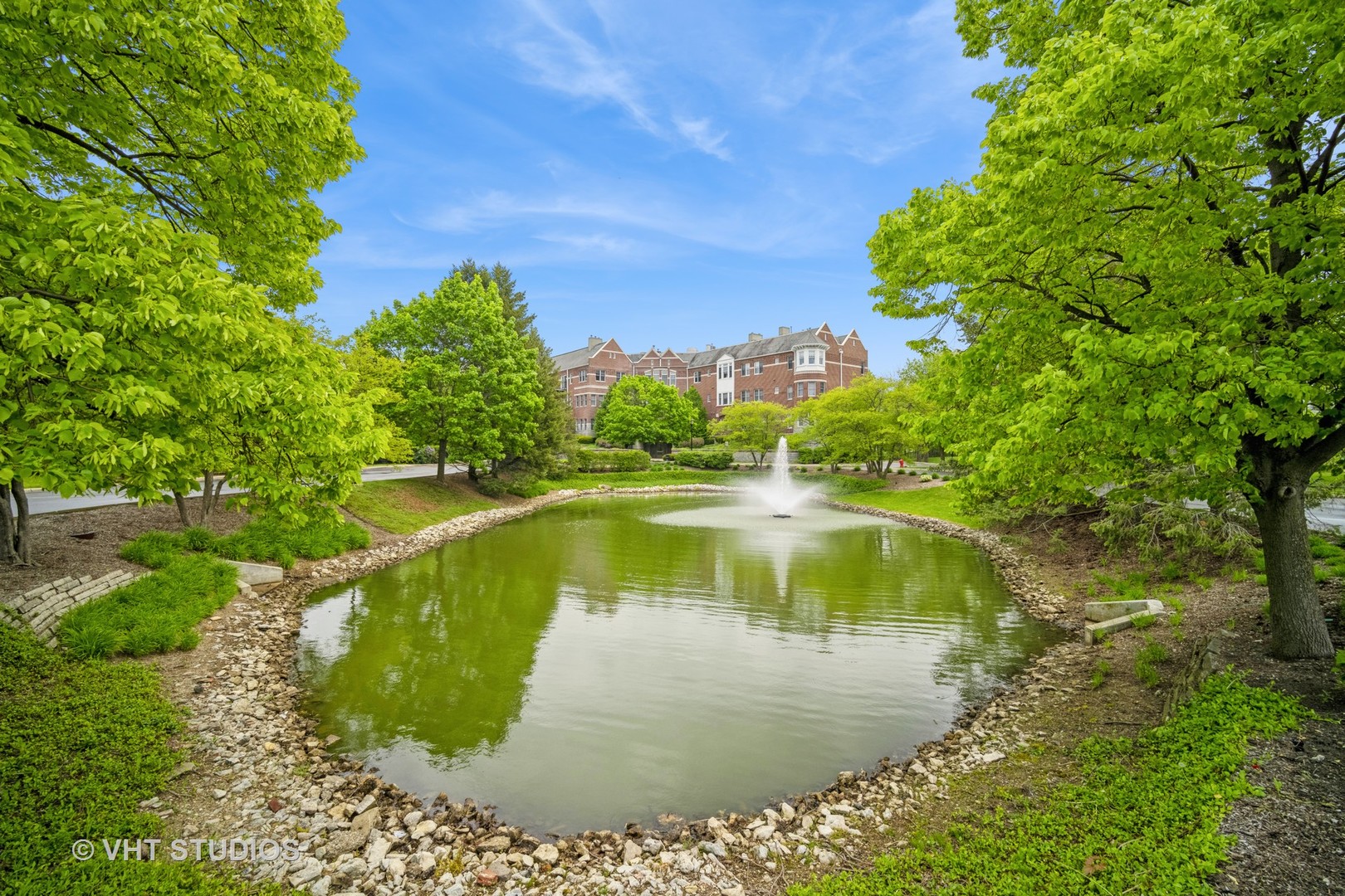 2365 Waukegan Road, Unit 3D Northbrook, IL 60062 - Photo 1 of 21 a view of a water pond with green yard