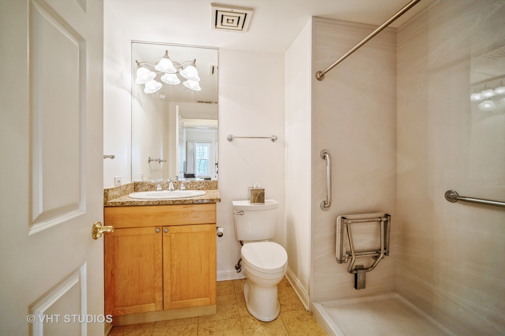 2365 Waukegan Road, Unit 3D Northbrook, IL 60062 - Photo 13 of 21 a bathroom with a granite countertop toilet sink and mirror