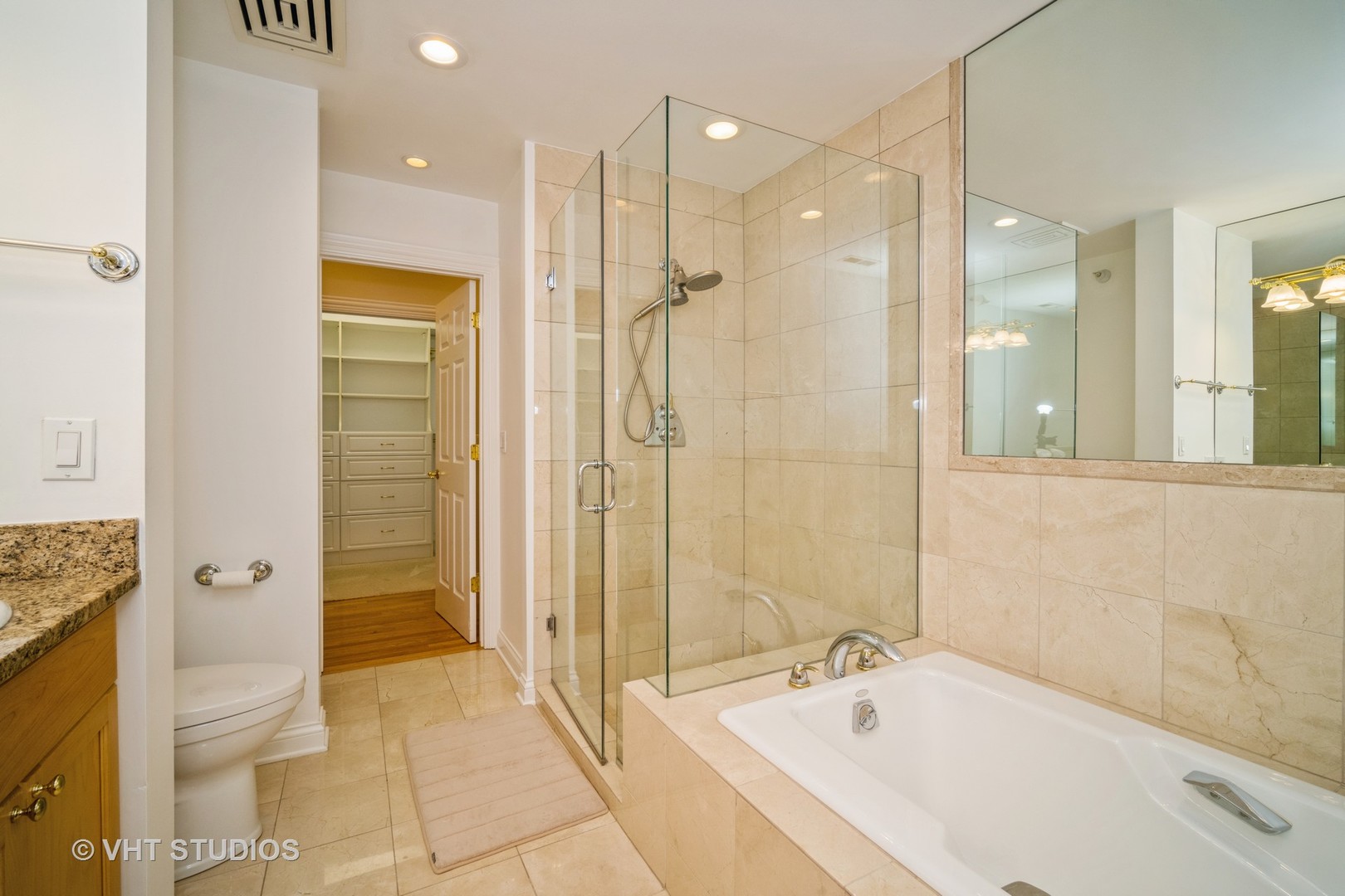 2365 Waukegan Road, Unit 3D Northbrook, IL 60062 - Photo 17 of 21 a bathroom with a bathtub and a shower