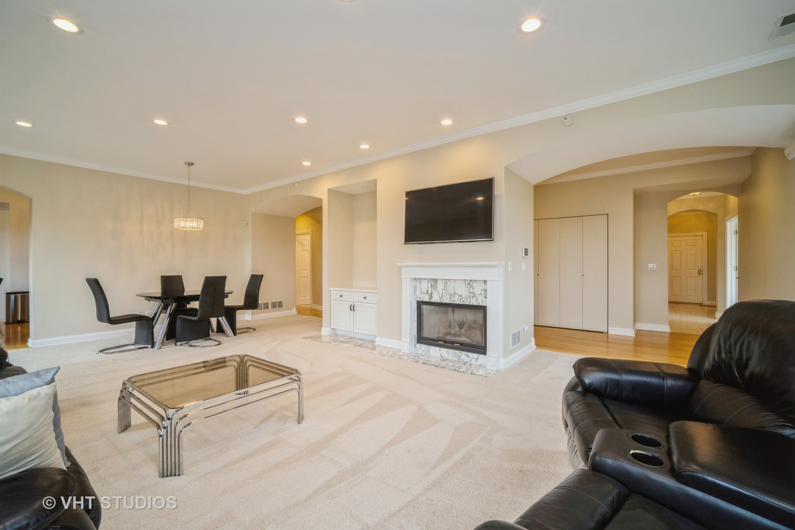 2365 Waukegan Road, Unit 3D Northbrook, IL 60062 - Photo 2 of 21 a living room with furniture fireplace and flat screen tv
