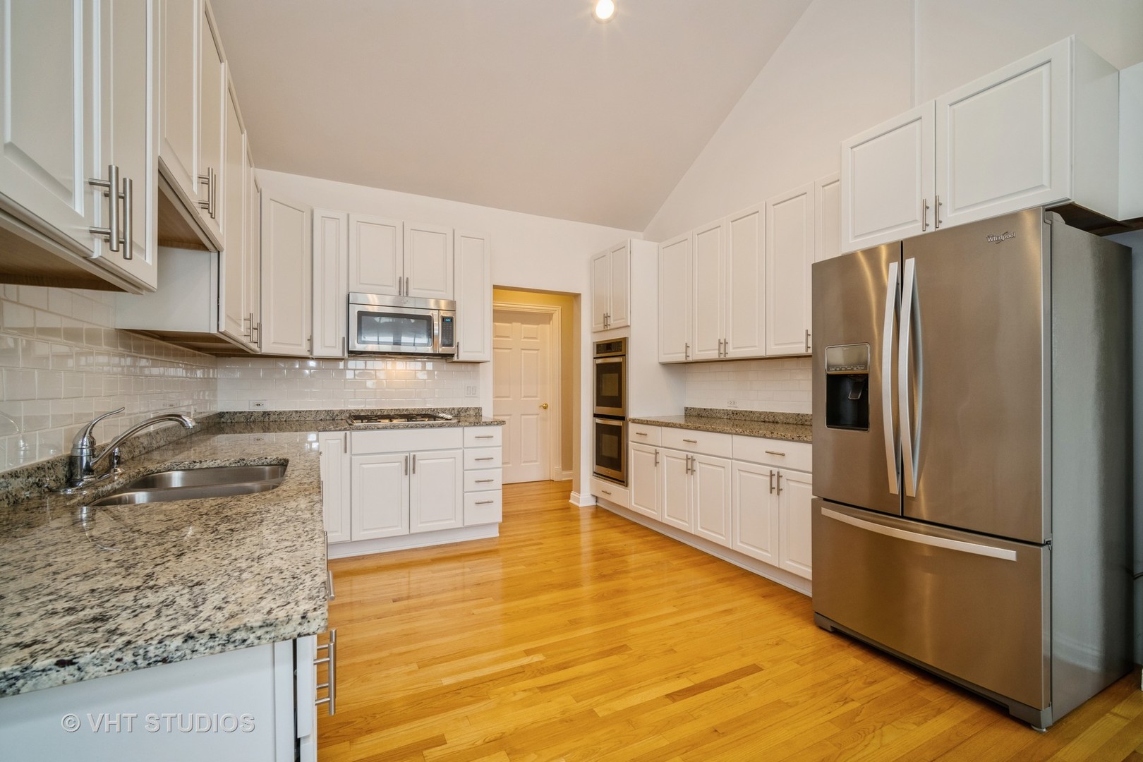 2365 Waukegan Road, Unit 3D Northbrook, IL 60062 - Photo 7 of 21 a kitchen with granite countertop white cabinets and stainless steel appliances