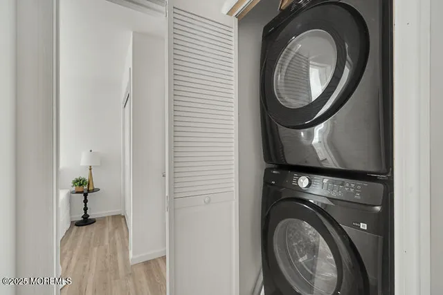a view of a hallway with washer and dryer