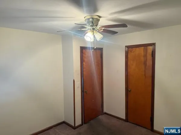 a view of a chandelier fan in a room